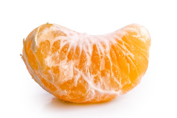 A segment of mandarin isolated on white.