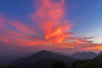 Amazing sunset.Natural Sunset Sunrise Over Mountain. Bright Dramatic Sky And Dark Ground.Colorful sky in the sunset.