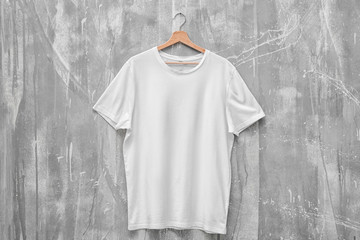 White t-shirt on grunge background. Mockup for design