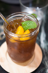 Iced tea with orange slices and mint