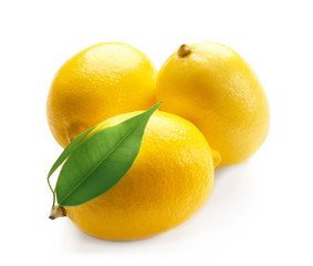 Fresh ripe lemons with leaves on white background
