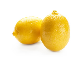 Fresh ripe lemons on white background