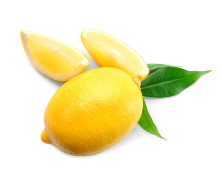 Fresh ripe lemon with leaves on white background