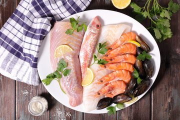 selection of raw fish, mussel and shrimp