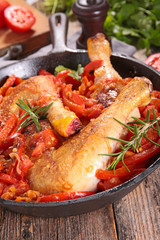 chicken leg cooked with tomato and bell pepper