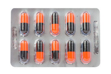 Orange and black capsule in blister pack