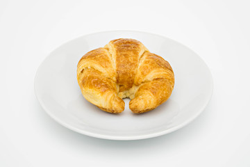 croissant on white plate.