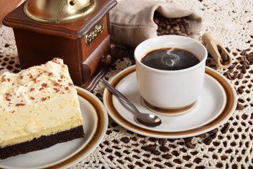 black coffee in a cup with chocolate cake