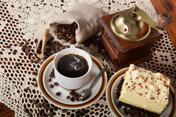 black coffee in a cup with chocolate cake
