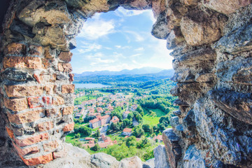 View of Avigliana town throw a window of an old castell