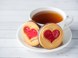 Homemade Cookies with a Red Jam Heart Valentine's Day Cup of tea
