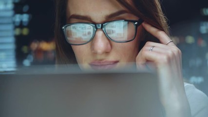 Smiling businesswoman working at modern office and using computer touchscreen, beautiful female manager using laptop looking at monitor - Powered by Adobe