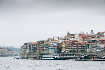 Boats floating in city river of Porto.