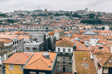 Fototapeta na wymiar Rooftops of old city of Porto in Portugal.