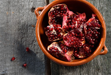 pottery pomegranate on wooden background