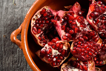 pottery pomegranate on wooden background