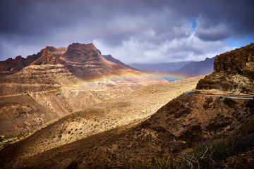 Rainbow over Mountain landscape of Gran Canaria island, Spain / Valley of "Fataga" seen from the viewpoint "Degollada de la yegua"