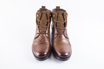 Male brown leather boot on white background, isolated product, comfortable footwear.