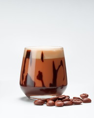 Coffee drink with chocolate in a glass isolated on white 