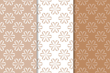 Brown floral backgrounds. Set of seamless patterns