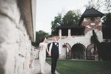 Wedding couple bride and groom holding hands