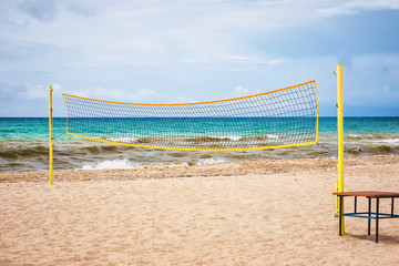 Volleyball net on a sand beach in summer