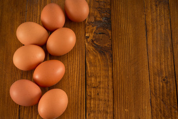 Fresh eggs on wooden table