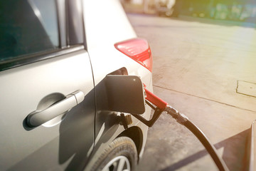 Car is refueling at a petrol station.