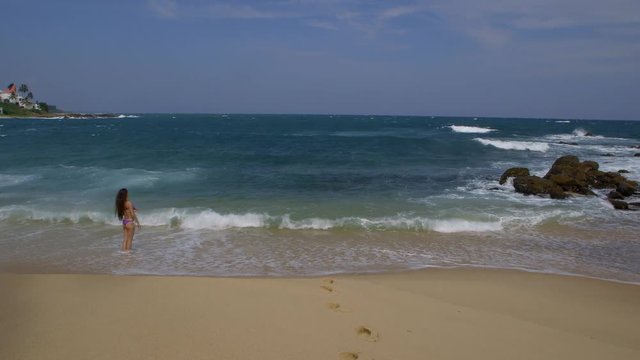 Woman In Surf On Indian Ocean Beach; Udawalawe To Peellagoda; Tangalle, Sri Lanka