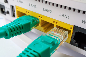 the green connectors for the Internet included in a router - obrazy, fototapety, plakaty