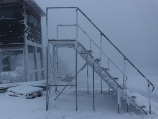 Staircase to nowhere covered with hoarfrost