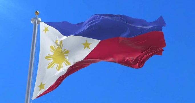 Flag of the Philippines waving at wind in slow with blue sky, loop