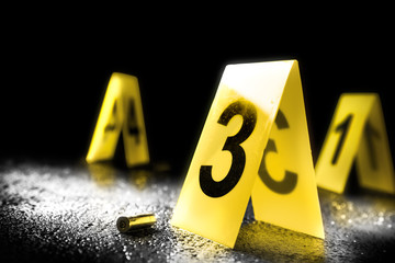 evidence markers on the floor, high contrast image