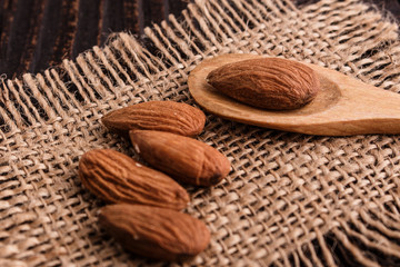 almond essential oil on a wooden background