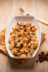 oriental pasta with dried grape pine nuts and carrot, SELECTIVE FOCUS