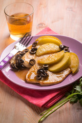 escalope with apple  and black olives, selective focus