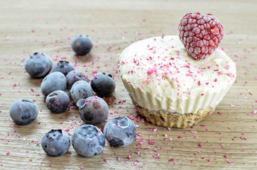 Raw vegan ice cream muffin with blueberries and raspberry