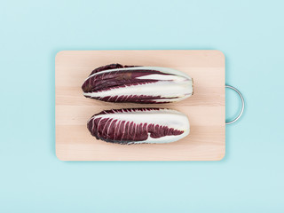 Red chicory on a chopping board