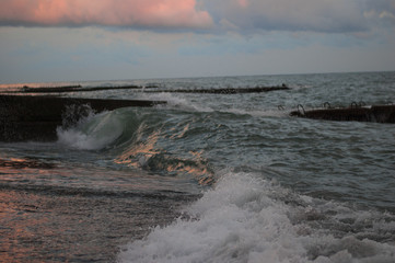 sunset, storm on the sea.waves, breakwater