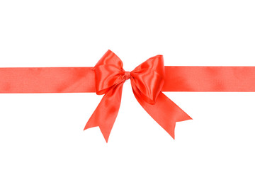 Shiny red satin ribbon with bow isolated on white background .