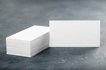 White Blank business card on concrete background. Place for ID