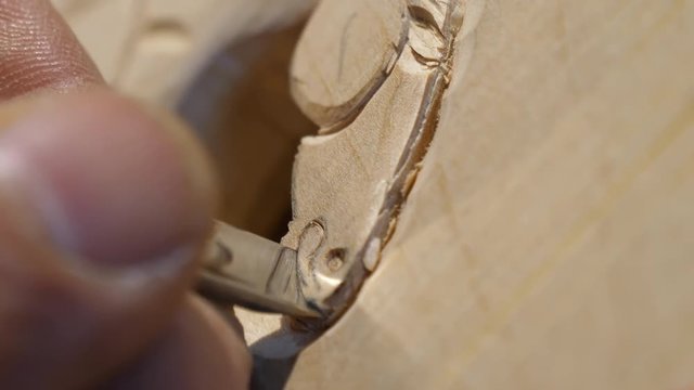 Wood Carver with chisel, close up
