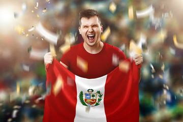 Fototapeta premium Peru is a fan, a fan of a man holding Peru's national flag in his hands. Soccer fan in the stadium. Mixed media