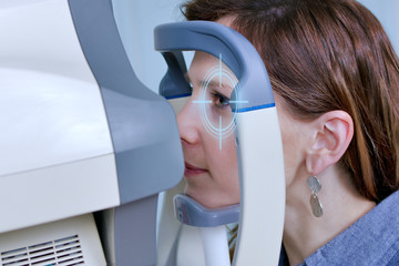 Checking eyesight in a clinic of the future, young girl. Ophthalmology. Future medicine and health...