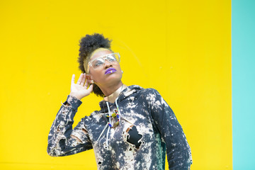 fashion portrait of young woman with purple lips listening