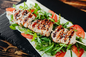 appetizing and delicious grilled meat dish with vegetables and herbs