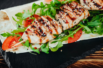 appetizing and delicious grilled meat dish with vegetables and herbs