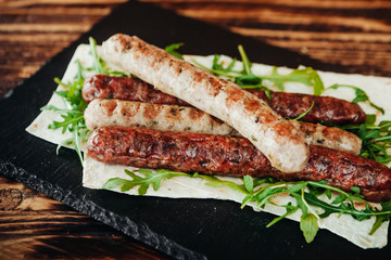 appetizing and delicious grilled meat dish with vegetables and herbs