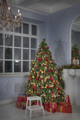 the studio shot of a Christmas tree with gift boxes