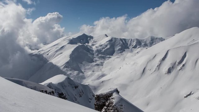 Wintime Lapse Of Wickedly Intense Clouds Roiling And Flowing Over Peaks. Zoom In